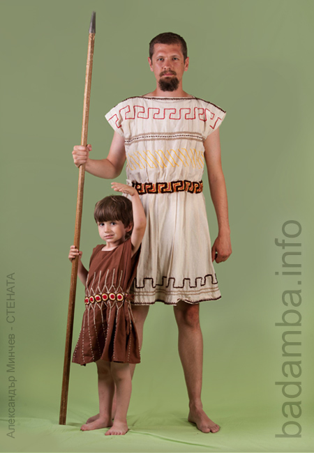 Young man and a little boy with a spear