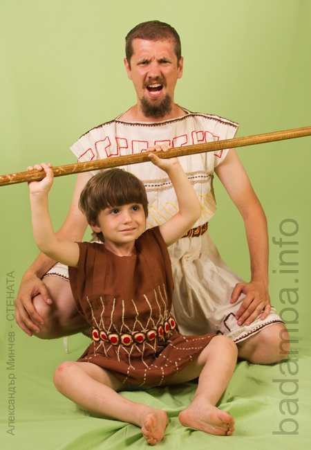 Young man and a little boy with a spear 5
